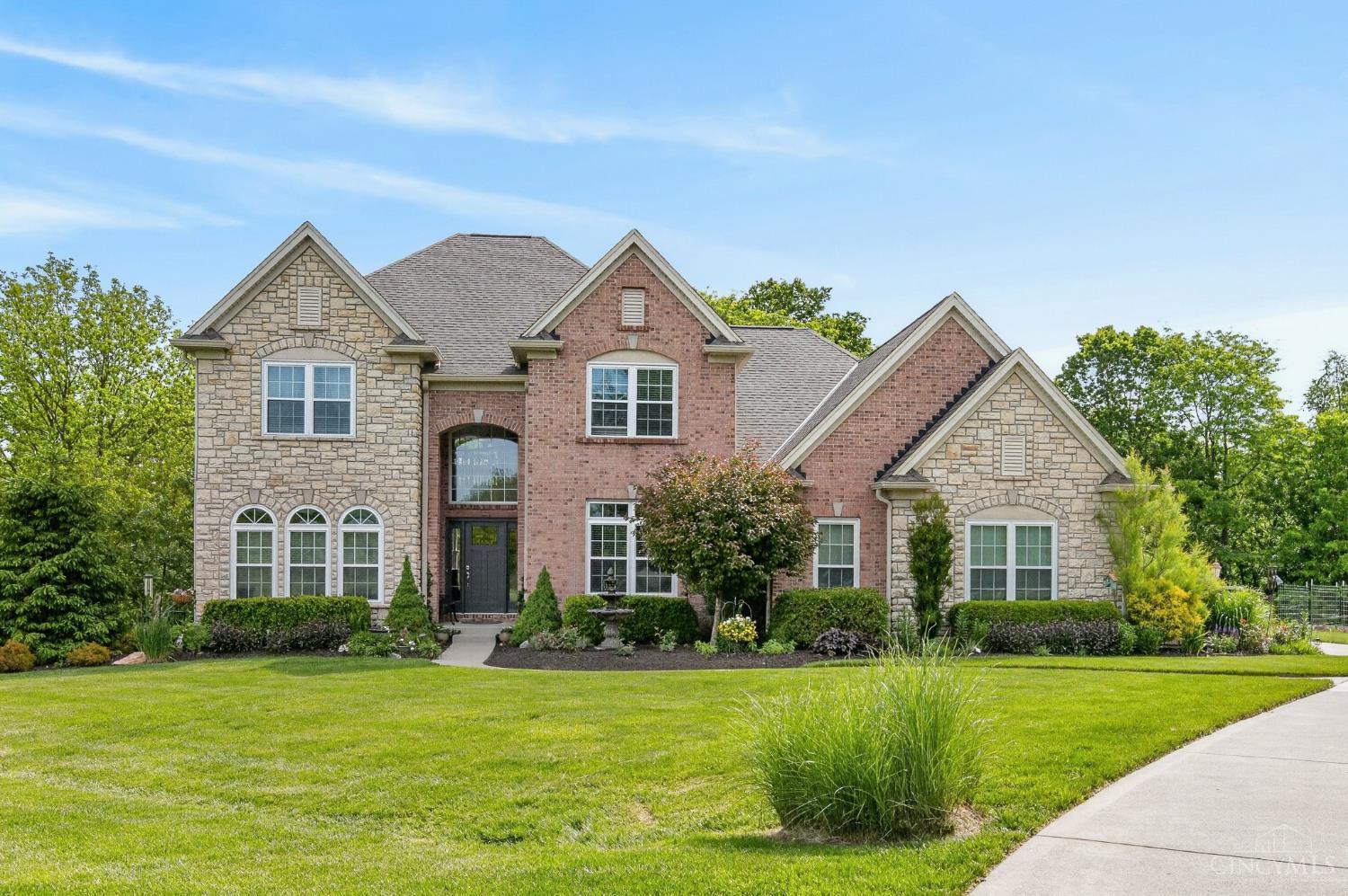 Brick-and-stone home and landscaped lawn at 4622 Misty Ridge Court, Salem Township.