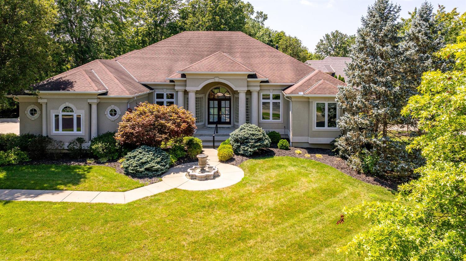 Mediterranean-style facade and fountain at 702 Winding River Boulevard, Hamilton Township.